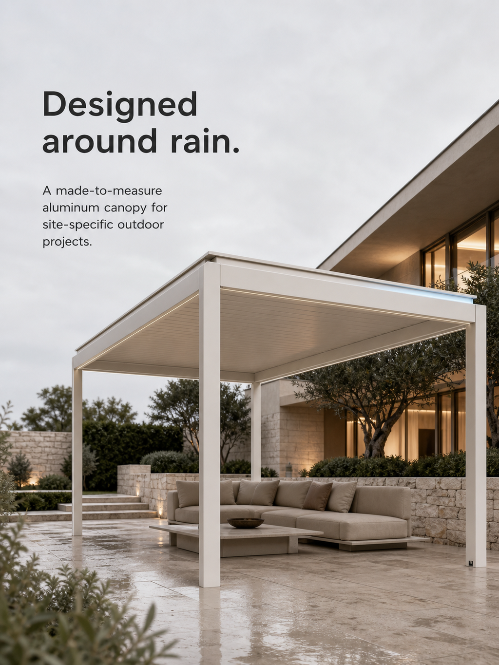 JINK Haven Aqua made-to-measure aluminum canopy on a contemporary outdoor terrace